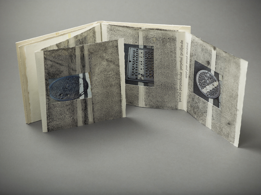 linearity at random. photographs and stencils, parallelisms from the street on archer paper. soft cover, edition of 101.